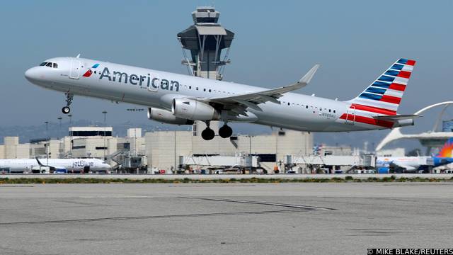 FILE PHOTO: An American Airlines Airbus A321 plane takes off from Los Angeles International airport