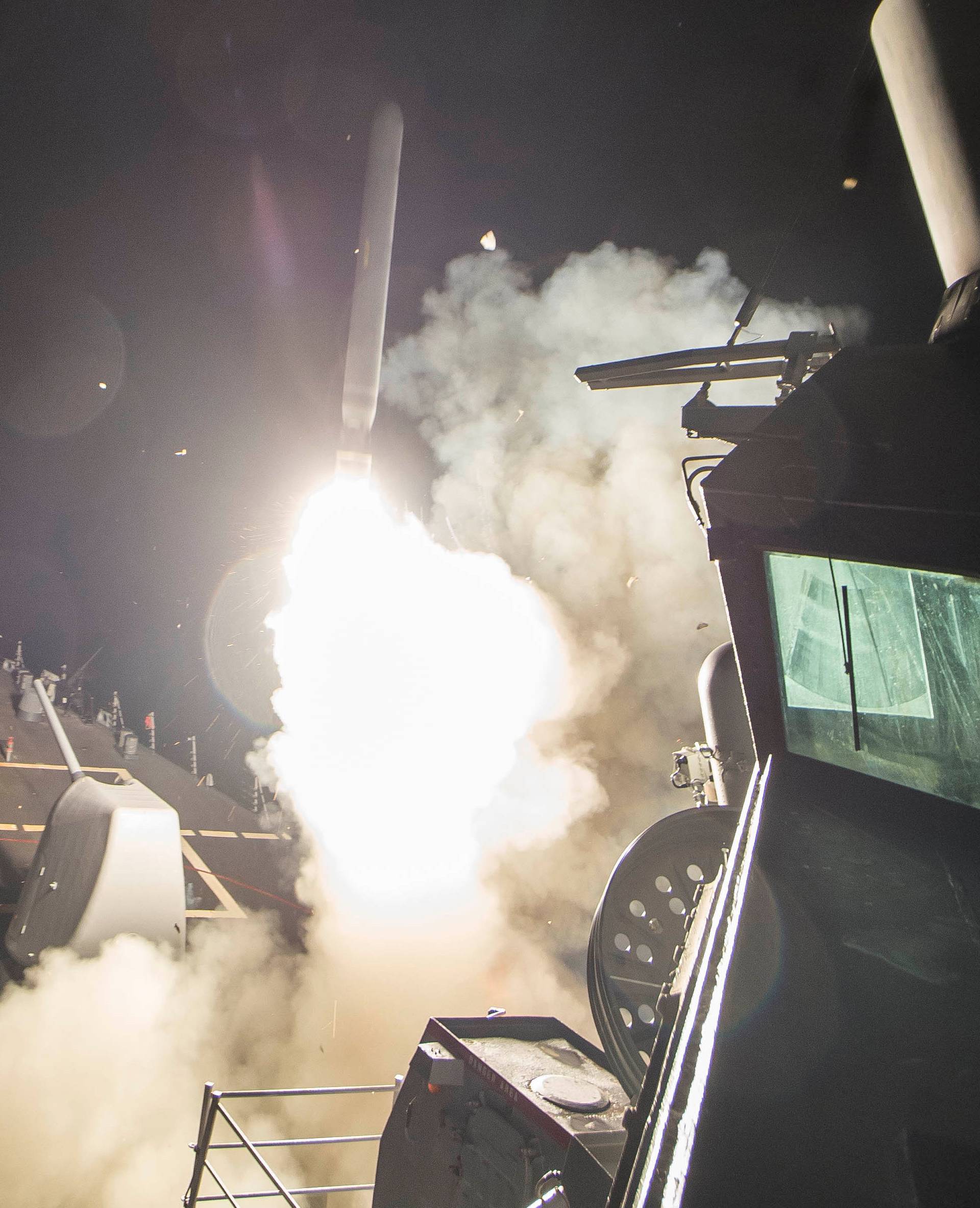 U.S. Navy guided-missile destroyer USS Ross (DDG 71) fires a tomahawk land attack missile in Mediterranean Sea