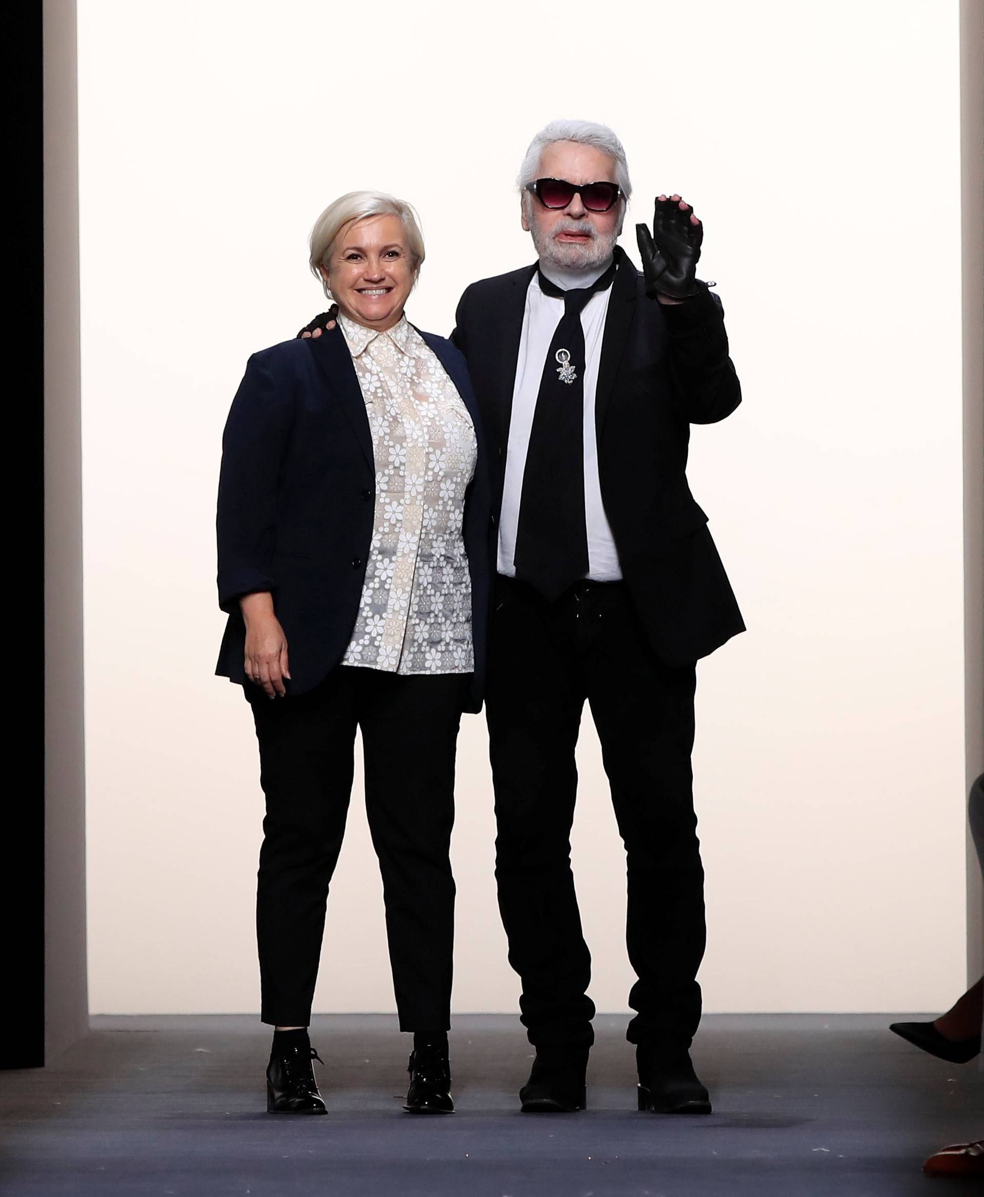 Designers Karl Lagerfeld and Silvia Venturini appears at the end of their Haute Couture Fall/Winter 2018/2019 collection show for fashion house Fendi in Paris