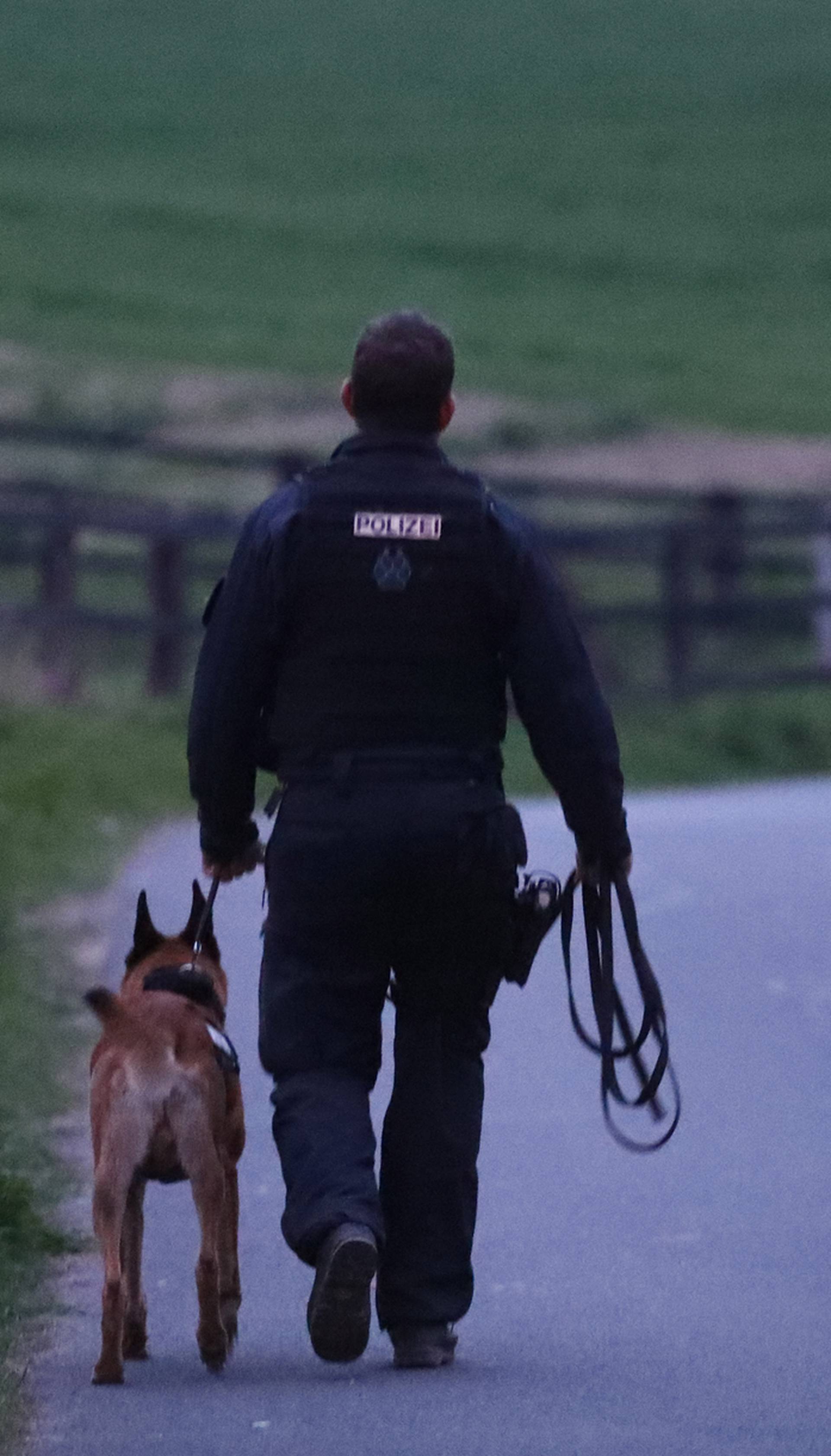 A police dog handler near the Borussia Dortmund team hotel after an explosion before the game