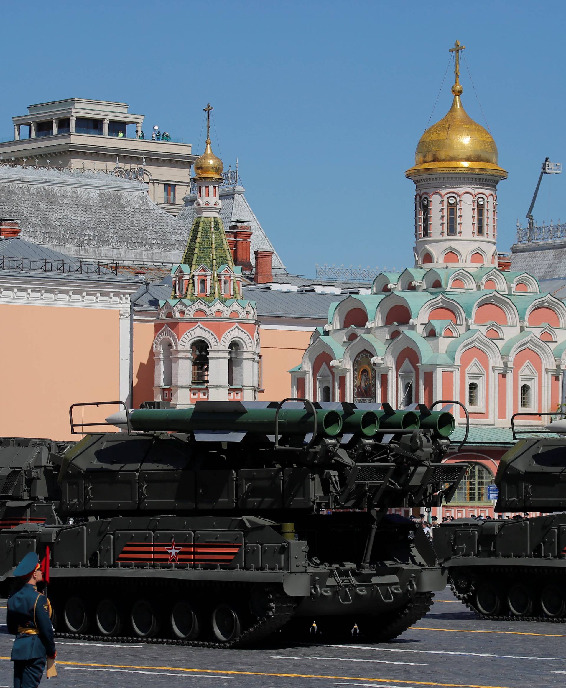 Russian servicemen drive military vehicles during the Victory Day parade at Red Square in Moscow