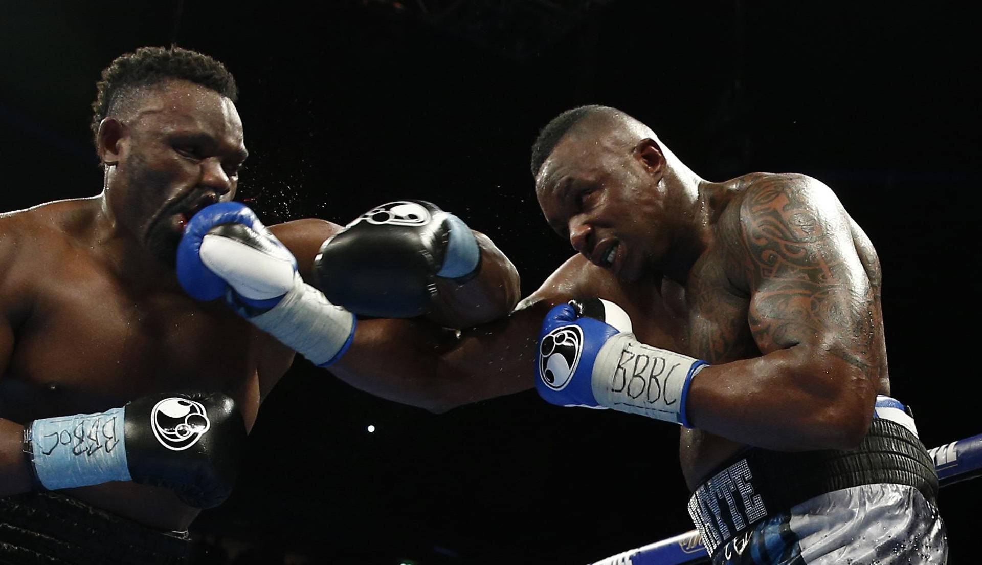 Dillian Whyte (R) in action against Dereck Chisora