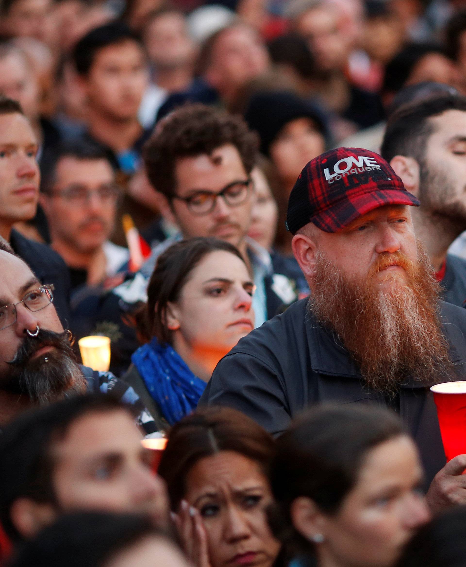 People attend a candlelight vigil for the victims of the Orlando shooting at a gay nightclub, held in San Francisco