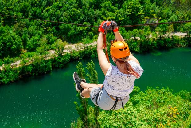 Women,Enjoying,A,Thrilling,Zipline,Experience,,Embracing,The,Exhilaration,Of