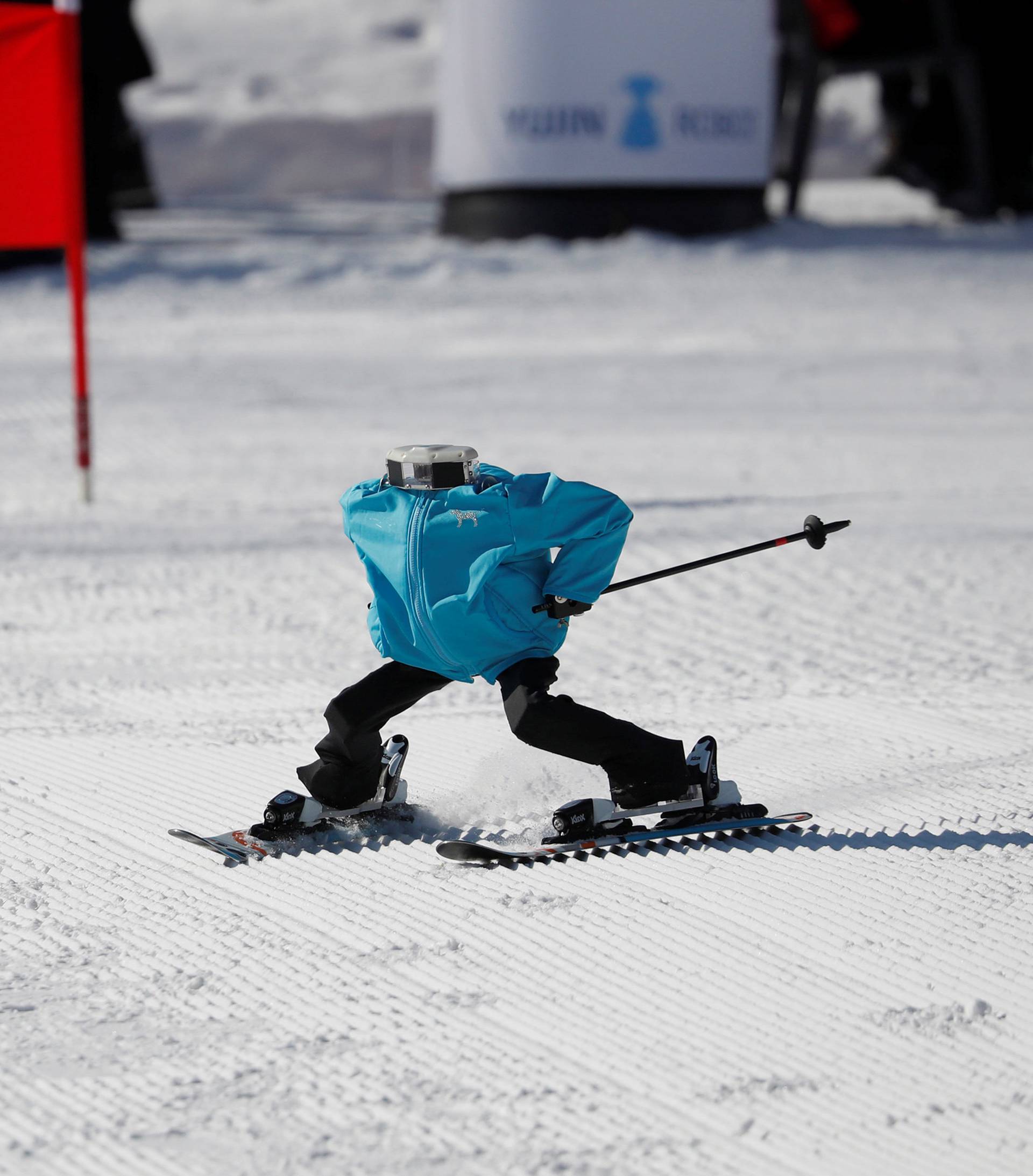 Robot Tae Kwon V skies during the Ski Robot Challenge at a ski resort in Hoenseong