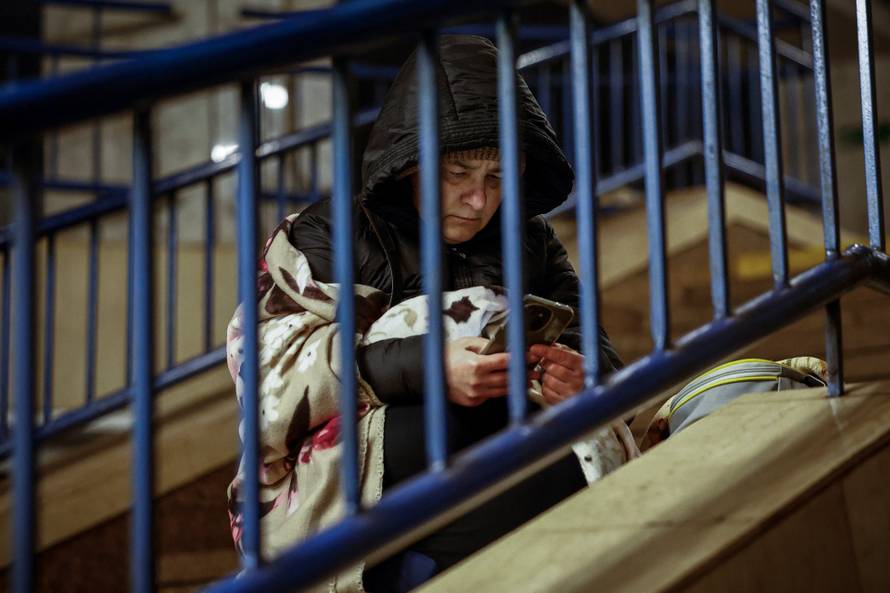 People take shelter inside a metro station during overnight Russian missile and drone attack, in Kyiv