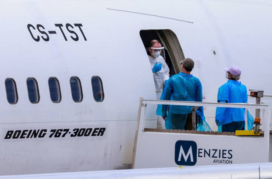 Passengers of the cruise ship MV Hondius, which was affected by a hantavirus outbreak, arrive at Tenerife Sud airport