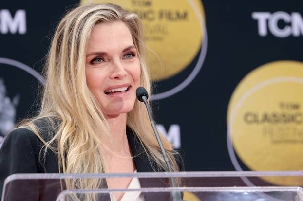 Ceremony for actor Michelle Pfeiffer to place her handprints and footprints in cement, in Los Angeles