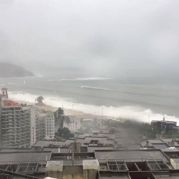 Strong winds and waves crashing onto a beach as Typhoon Mangkhut approaches Shenzhen