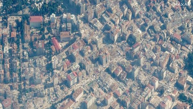 A satellite image shows collapsed buildings after an earthquake in Antakya