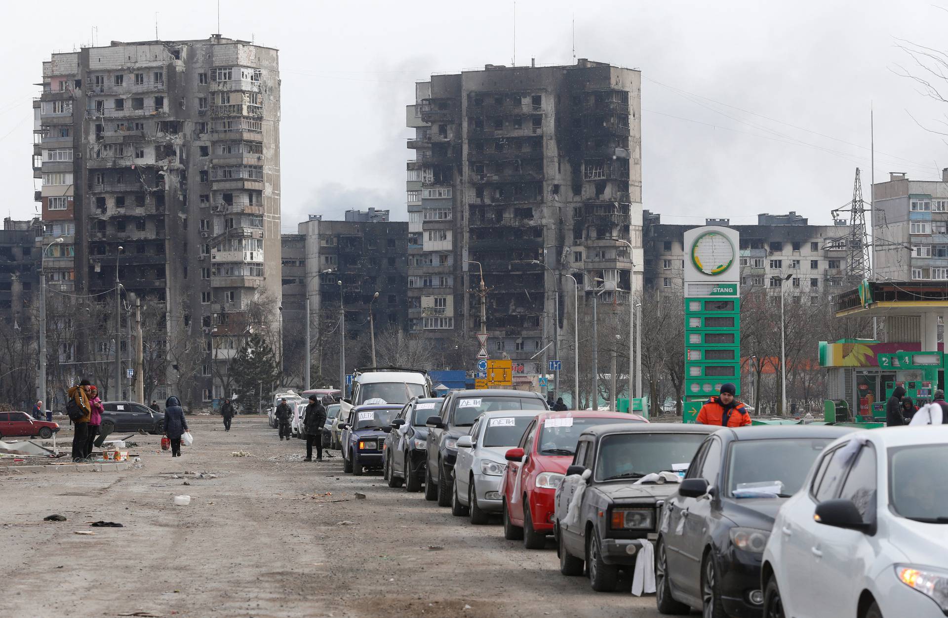 Evacuees leave the besieged city of Mariupol