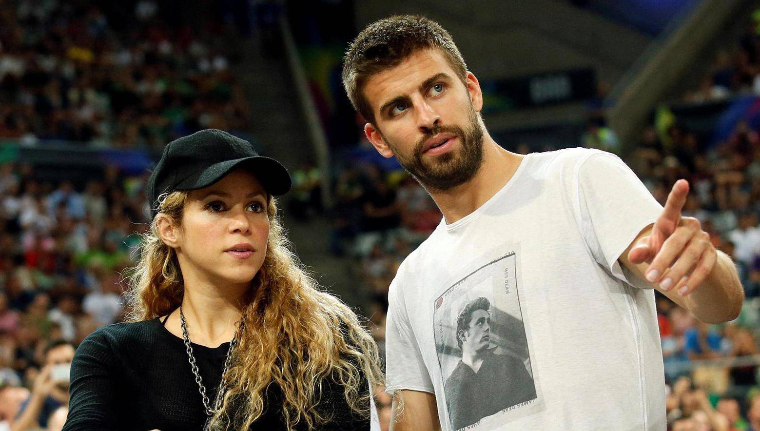 FILE PHOTO: Colombian singer Shakira and her partner, Barcelona soccer player Pique, attend the Basketball World Cup quarter-final game between the U.S. and Slovenia in Barcelona