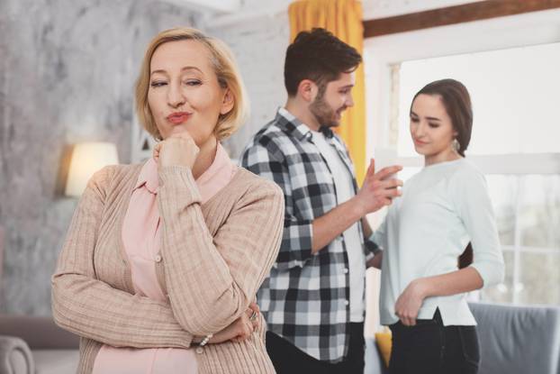 Sly elderly woman smiling