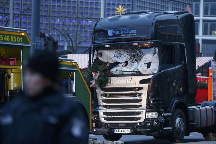 The crashed window of a truck is seen at a Berlin Christmas market
