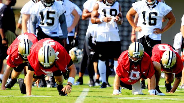 FILE PHOTO: New Orleans Saints players work out during a NFL training camp in Metairie