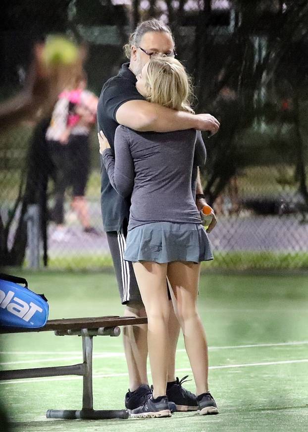 *EXCLUSIVE* Russell Crowe gets cozy with a younger woman while spending time at the tennis courts in Sydney!