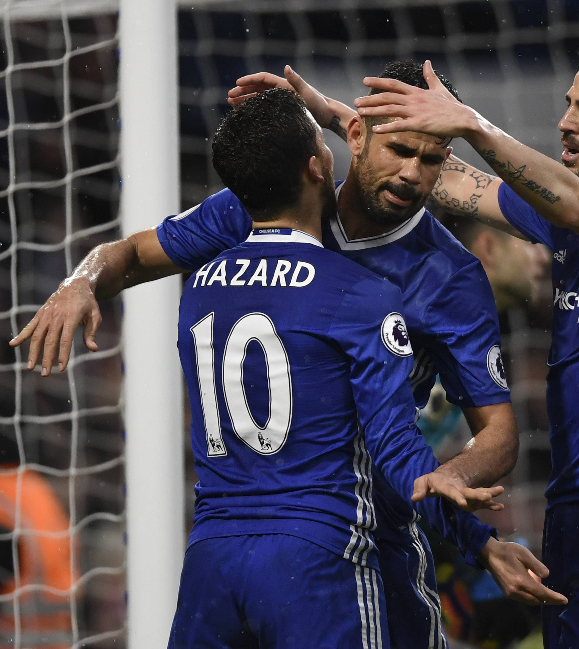 Chelsea's Diego Costa celebrates scoring their third goal with Eden Hazard and Cesc Fabregas