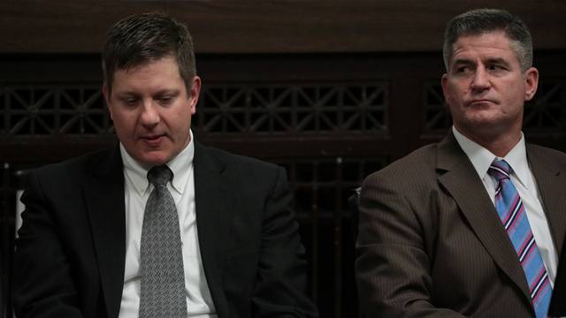 Chicago police officer Van Dyke reacts to his guilty verdict, as his attorney Herbert looks on during his trial for the shooting death of Laquan McDonald, in Chicago