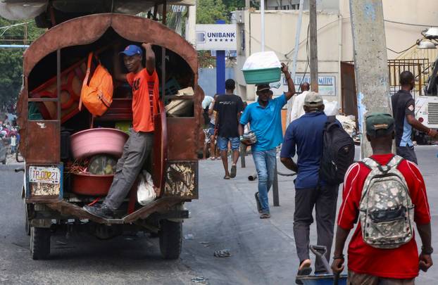 Haitians flee homes due to gang violence, in Port-au-Prince