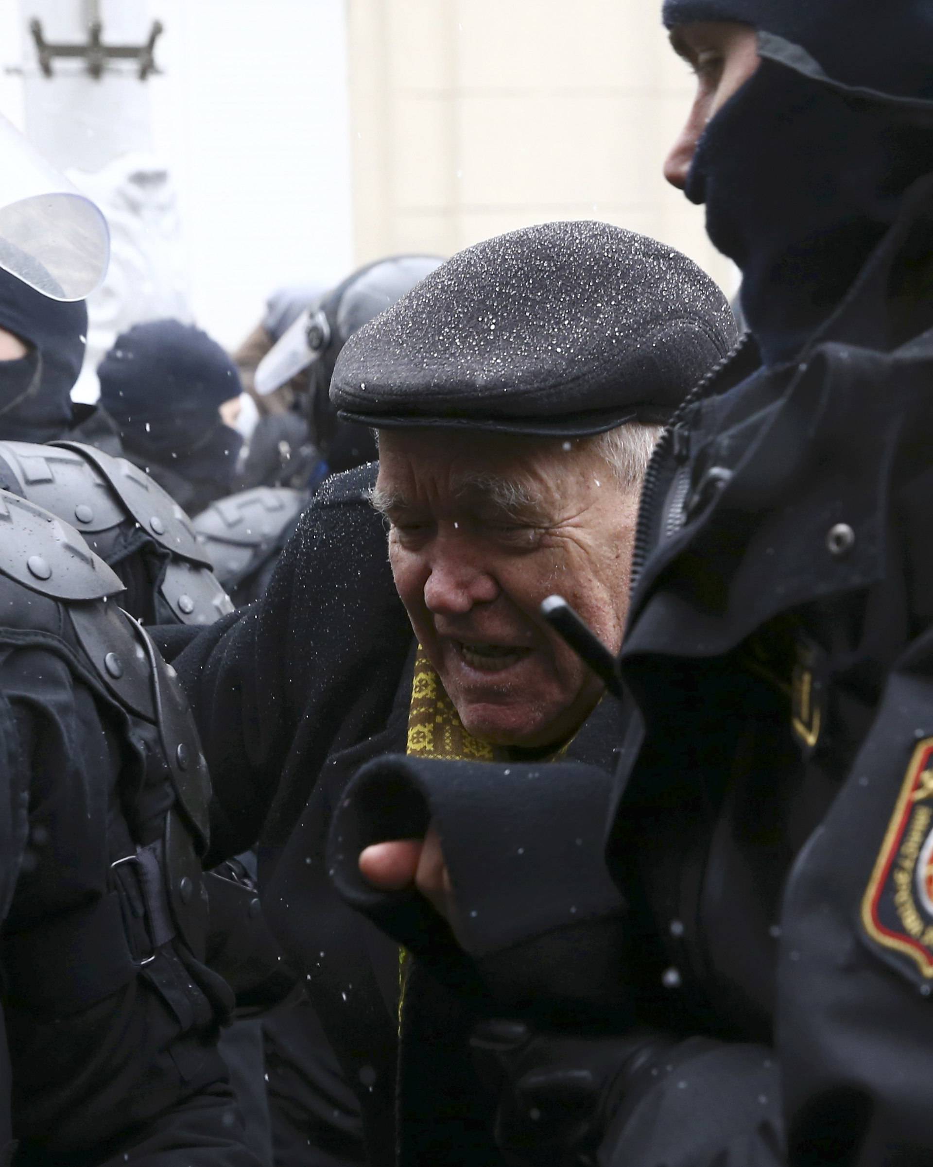 A man reacts during a gathering which marks the anniversary of the proclamation of the Belarussian People's Republic in Minsk