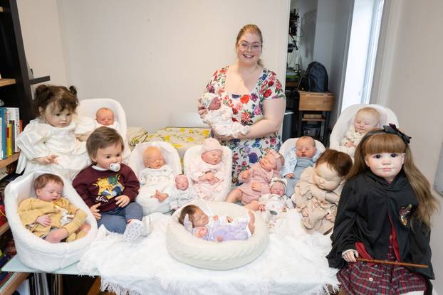 Couple are 'mum' and 'dad' to 13 fake babies - change their nappies, take them out in a pram and say it is preparing them for parenthood