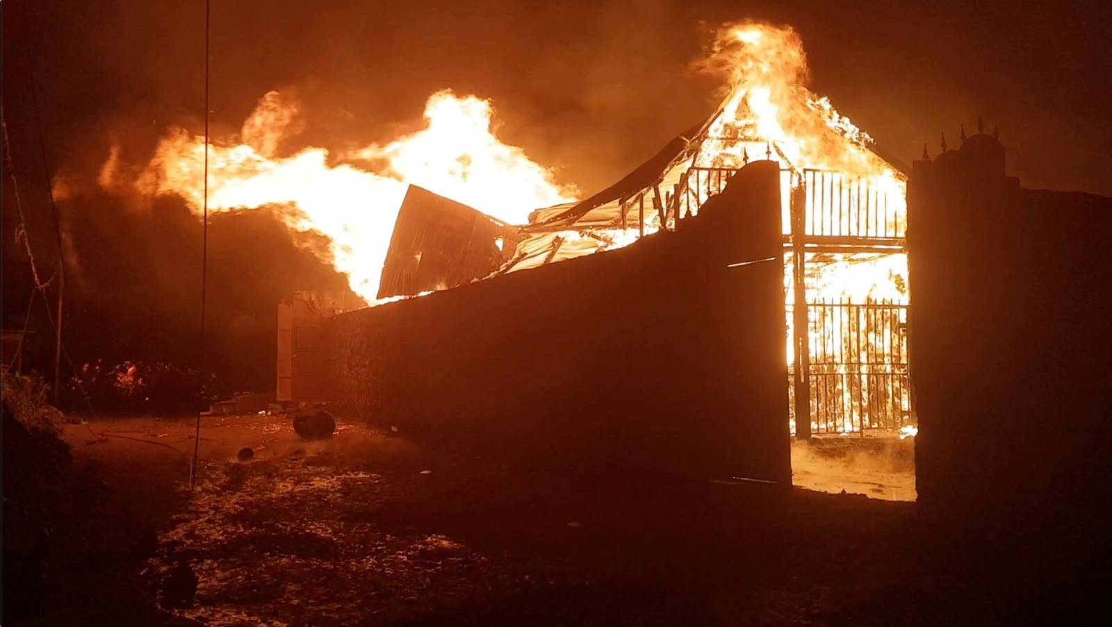 A building burns after the volcanic eruption of Mount Nyiragongo, in Goma