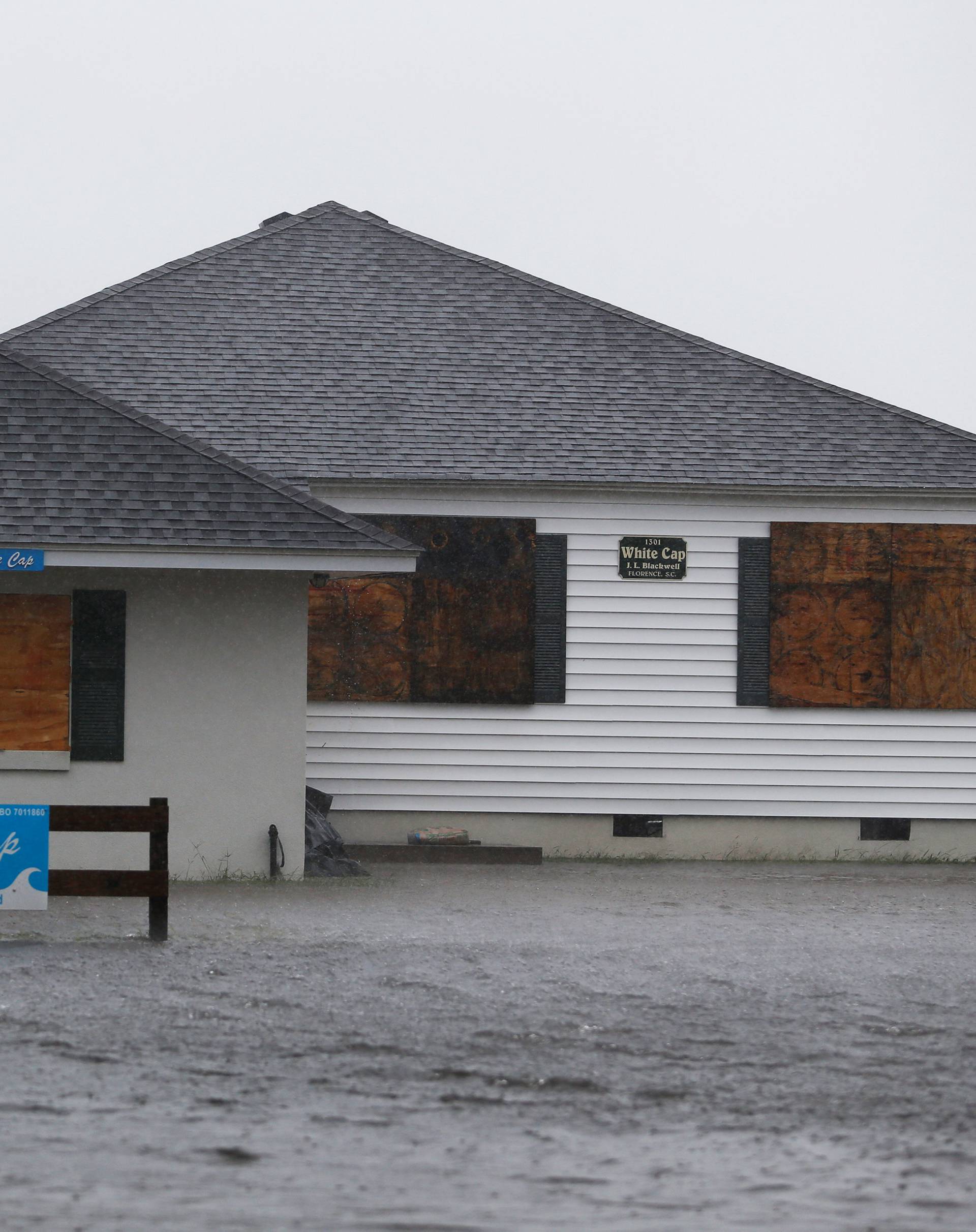 A house is surrounded by water during Hurricane Florence in North Myrtle Beach