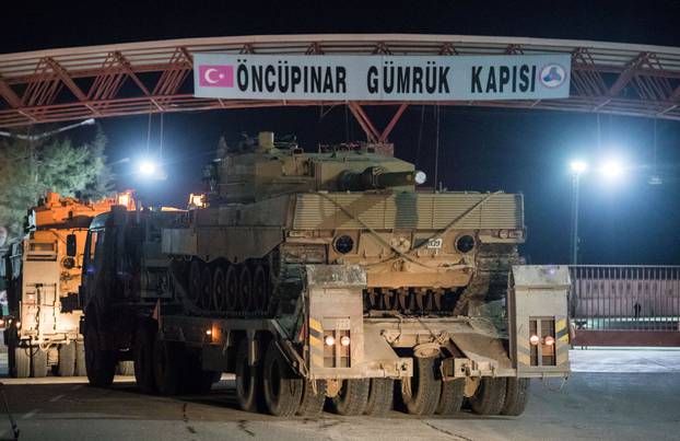 Turkish military vehicles cross into Syria at Oncupinar border gate in Kilis