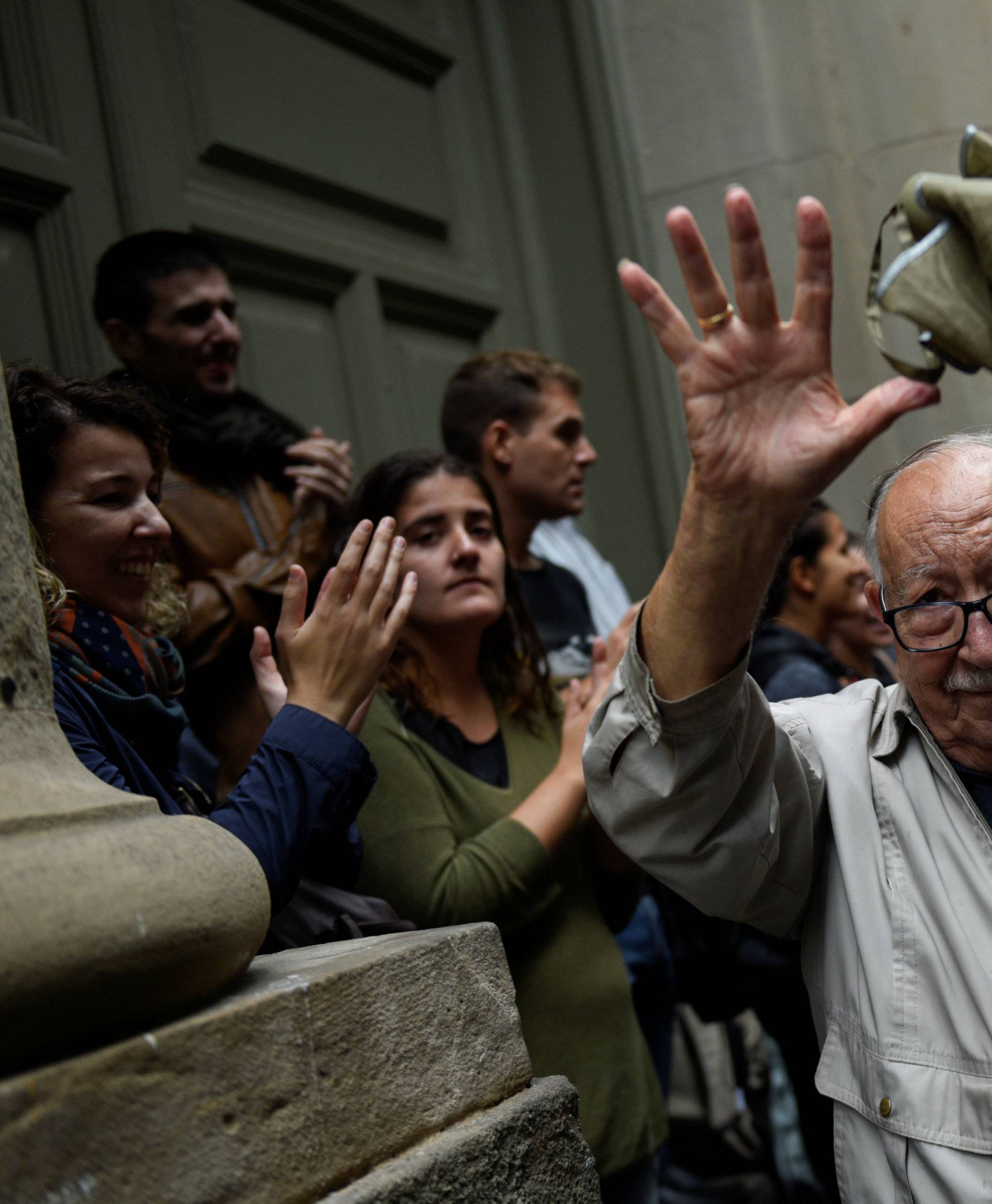 A man reacts as he leaves a polling station after casting his vote for the banned separatist referendum in Barcelona