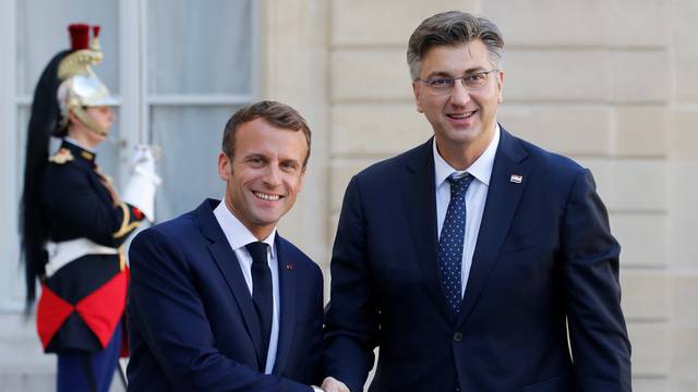 French President Emmanuel Macron welcomes Croatian Prime Minister Andrej Plenkovic at the Elysee Palace in Paris
