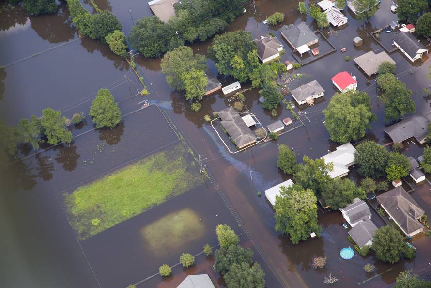 Contaminated floodwaters impact a neighborhood as seen in an aerial view in Sorrento, Louisiana