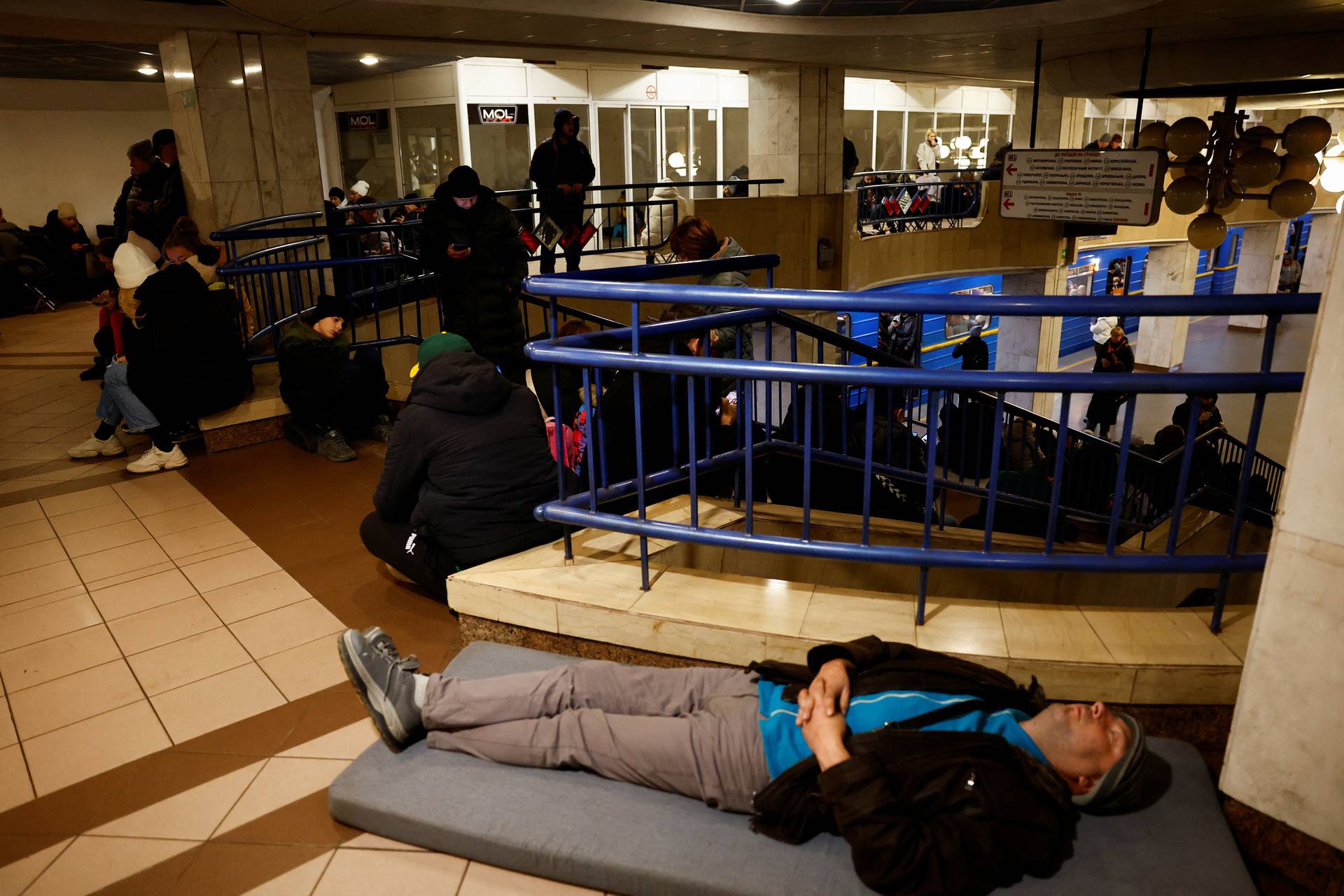 People take shelter during a Russian missile and drone attack, in Kyiv