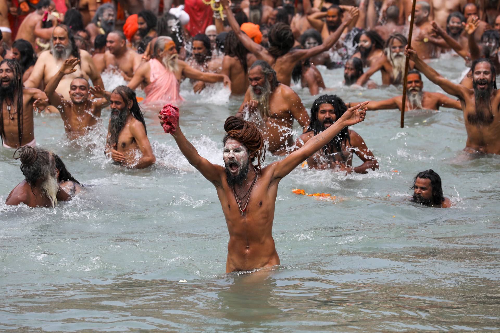 Naga Sadhus, or Hindu holy men, take a dip in the Ganges river during the second Shahi Snan at Kumbh Mela, in Haridwar