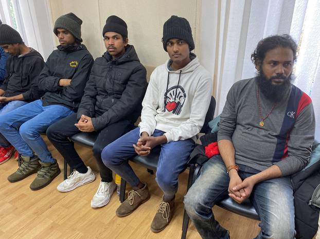 Sri Lanka citizens, who Ukrainian authorities say had been held by Russian forces since March and were rescued during a counteroffensive operation in Kharkiv region, attend a news conference in Kharkiv