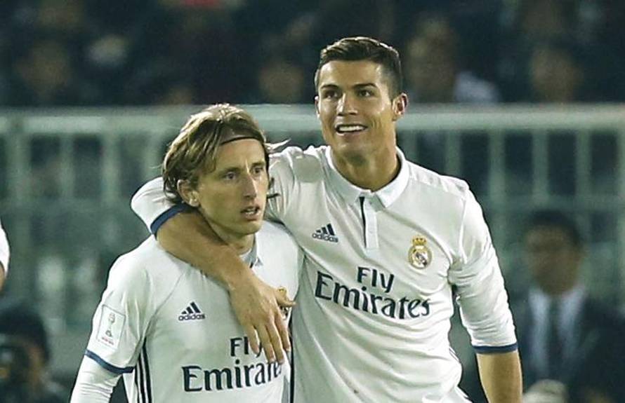 Real Madrid's Cristiano Ronaldo celebrates scoring their fourth goal with Luka Modric