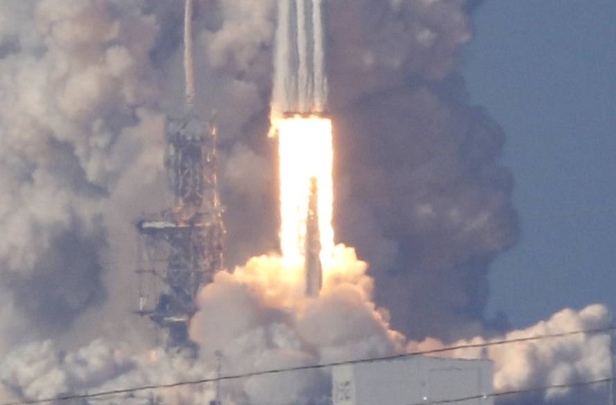 A SpaceX Falcon Heavy rocket lifts off from the Kennedy Space Center in Cape Canaveral