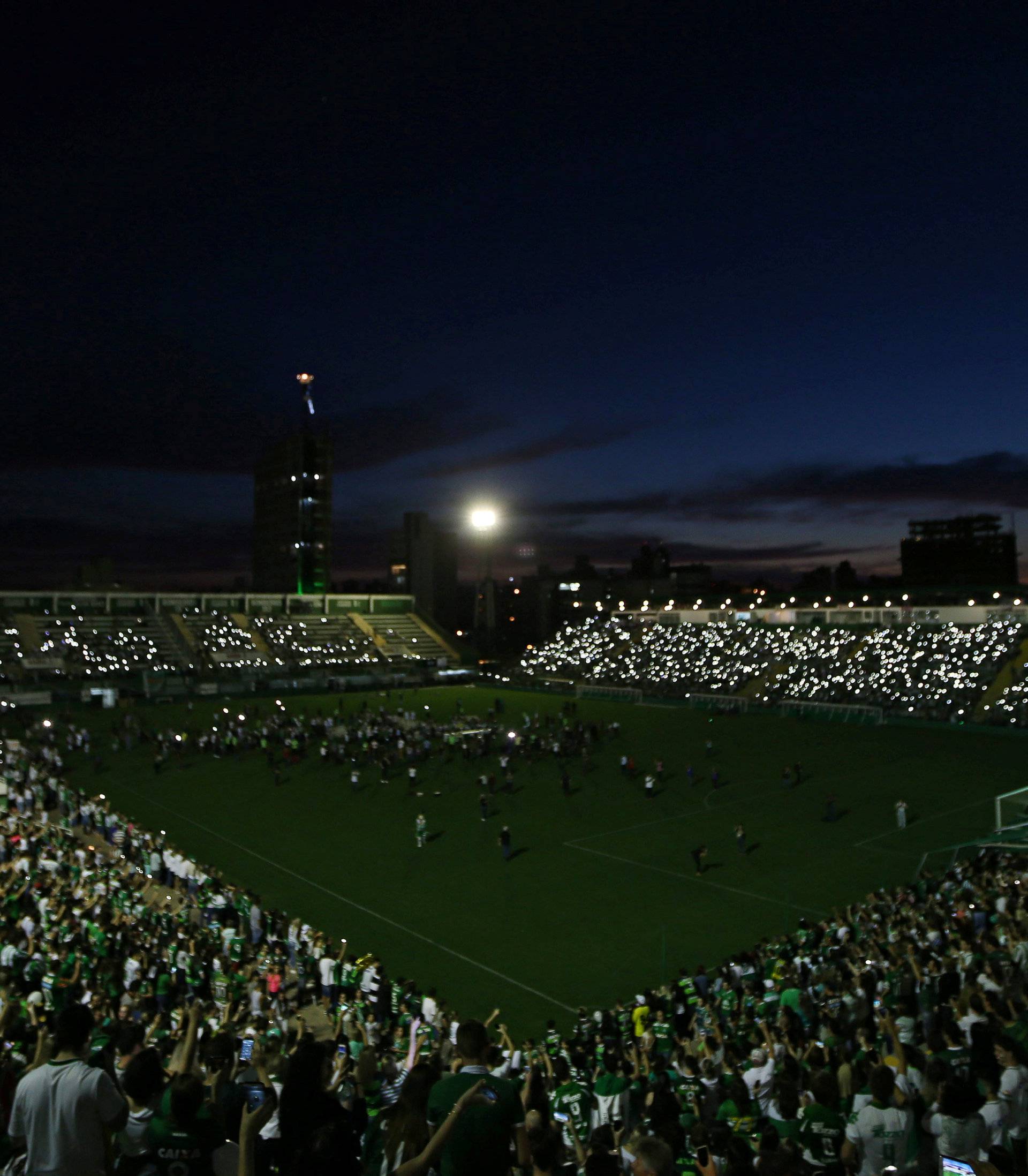 Fans of Chapecoense soccer team pay tribute to Chapecoense's players at the Arena Conda stadium in Chapeco