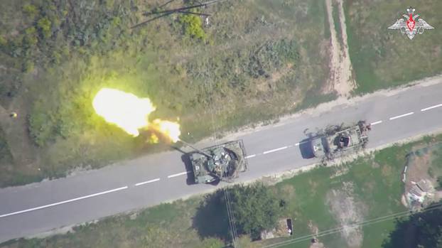 An aerial view shows what is said to be a firing Ukrainian tank in Kursk region