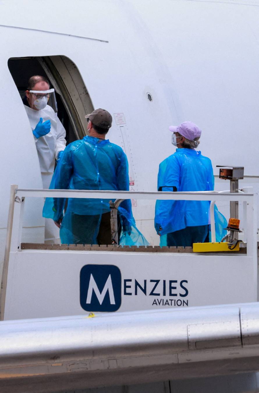 Passengers of the cruise ship MV Hondius, which was affected by a hantavirus outbreak, arrive at Tenerife Sud airport