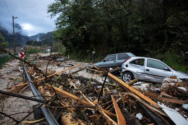 A view of damaged vehicles at a flooded residential area in Donja Jablanica