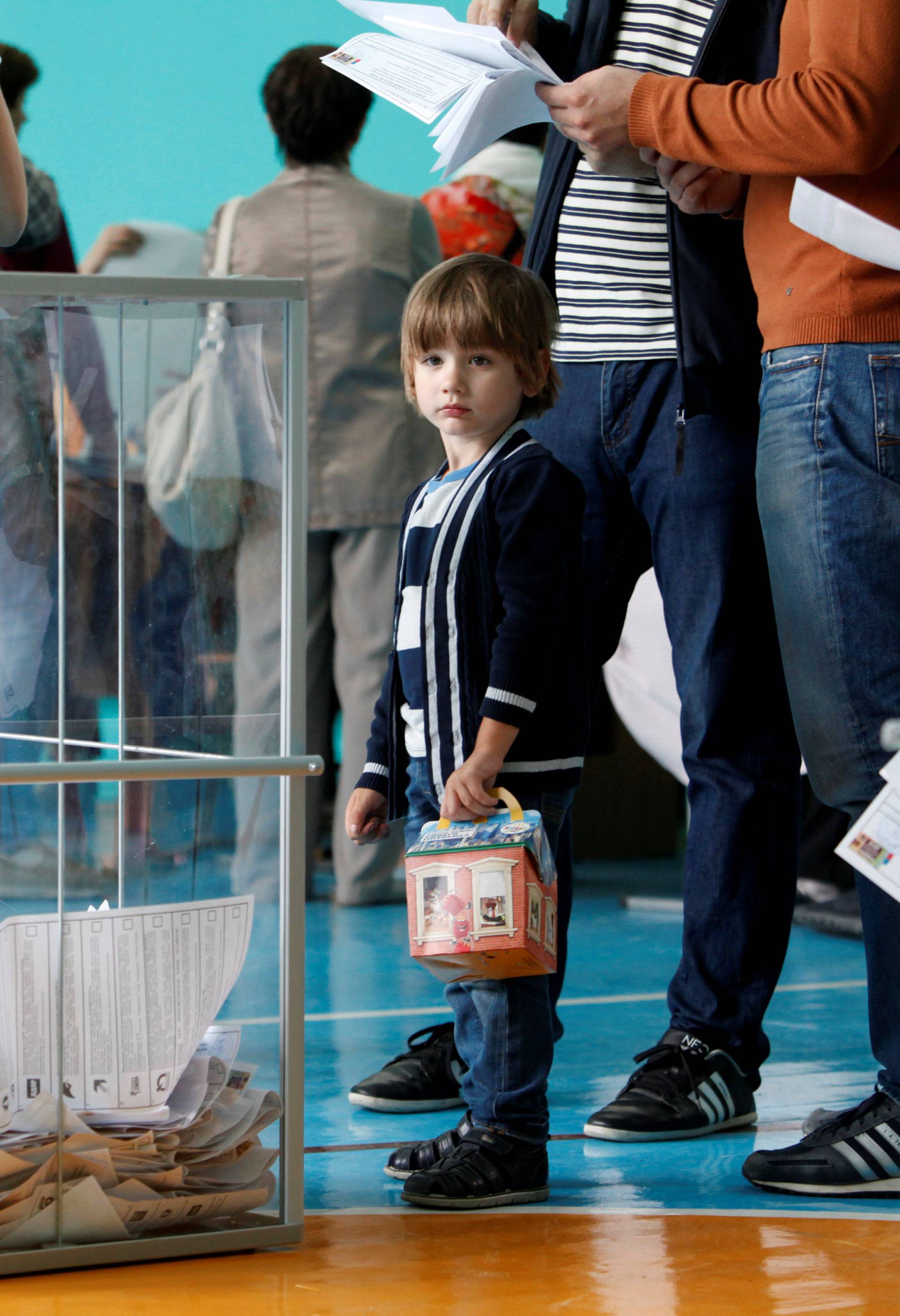 People visit polling station during parliamentary election in Stavropol