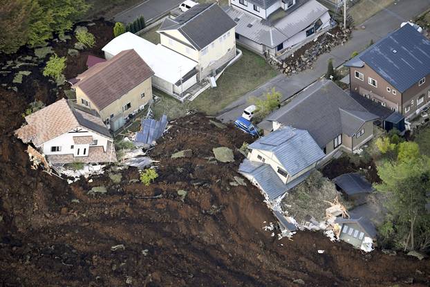 The aftermath of a landslide and destroyed houses caused by an earthquake are seen in Minamiaso town, Kumamoto prefecture