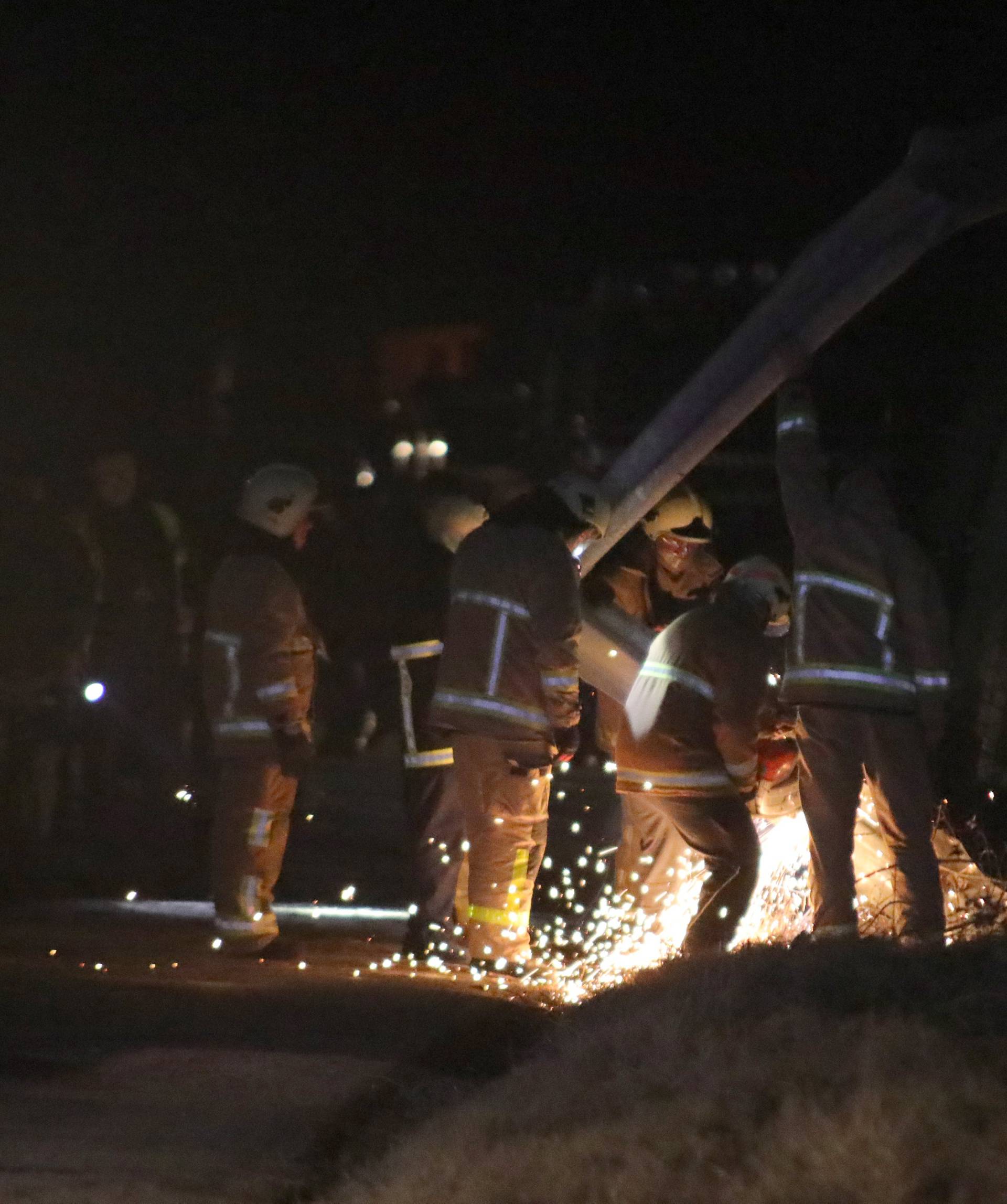 Rescue workers are seen at the site of of a bus accident, near Skopje