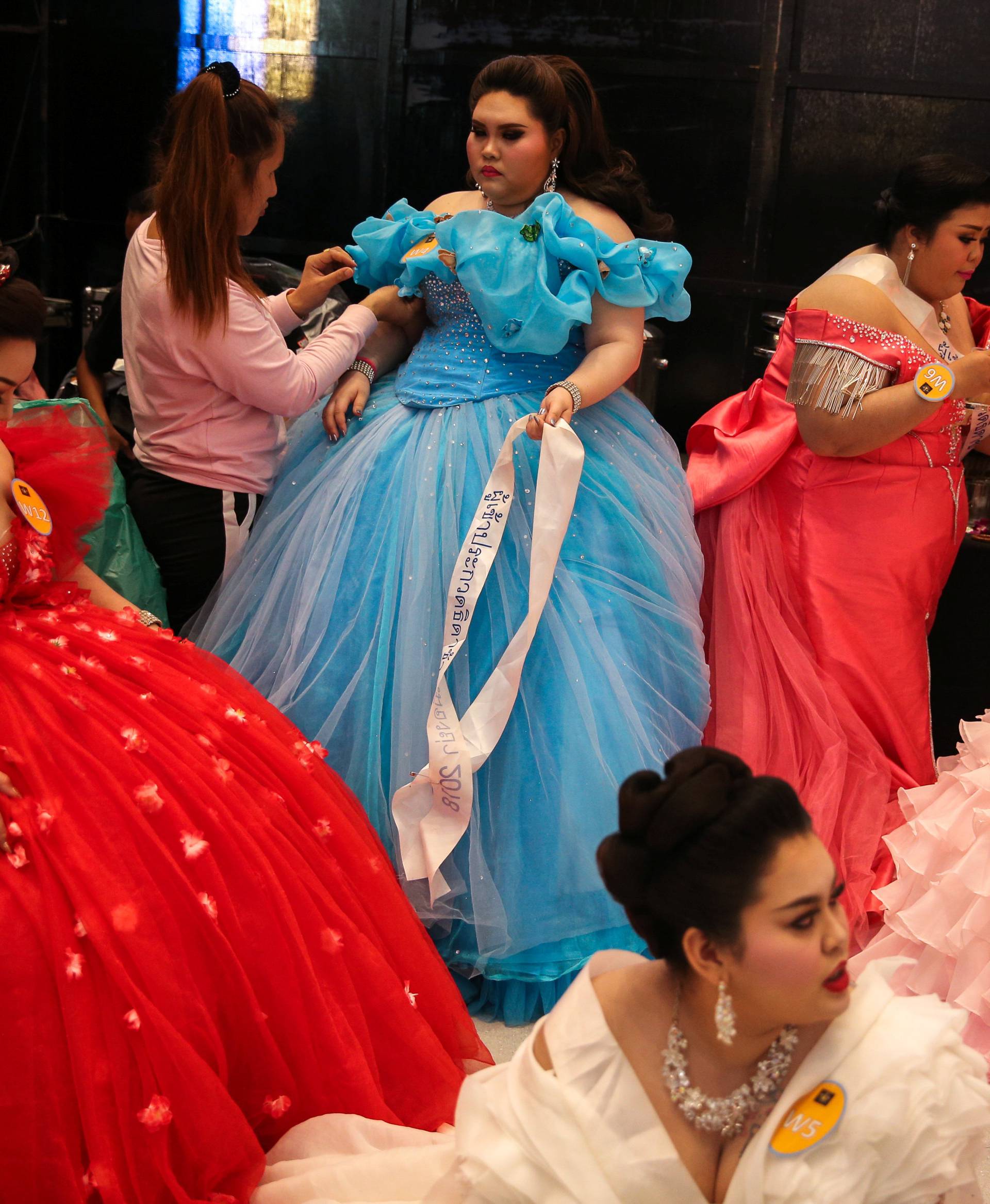 Participants prepare backstage before the final show of the Miss Jumbo 2018 at a department store in Nakhon Ratchasima