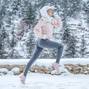 The woman goes in for sports. The girl runs in the winter