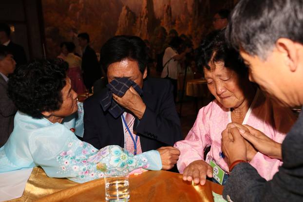 North and South Korean family members meet during a reunion at North Korea