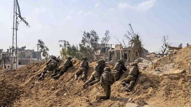 IDF handout image shows Israeli soldiers take position in the Gaza Strip