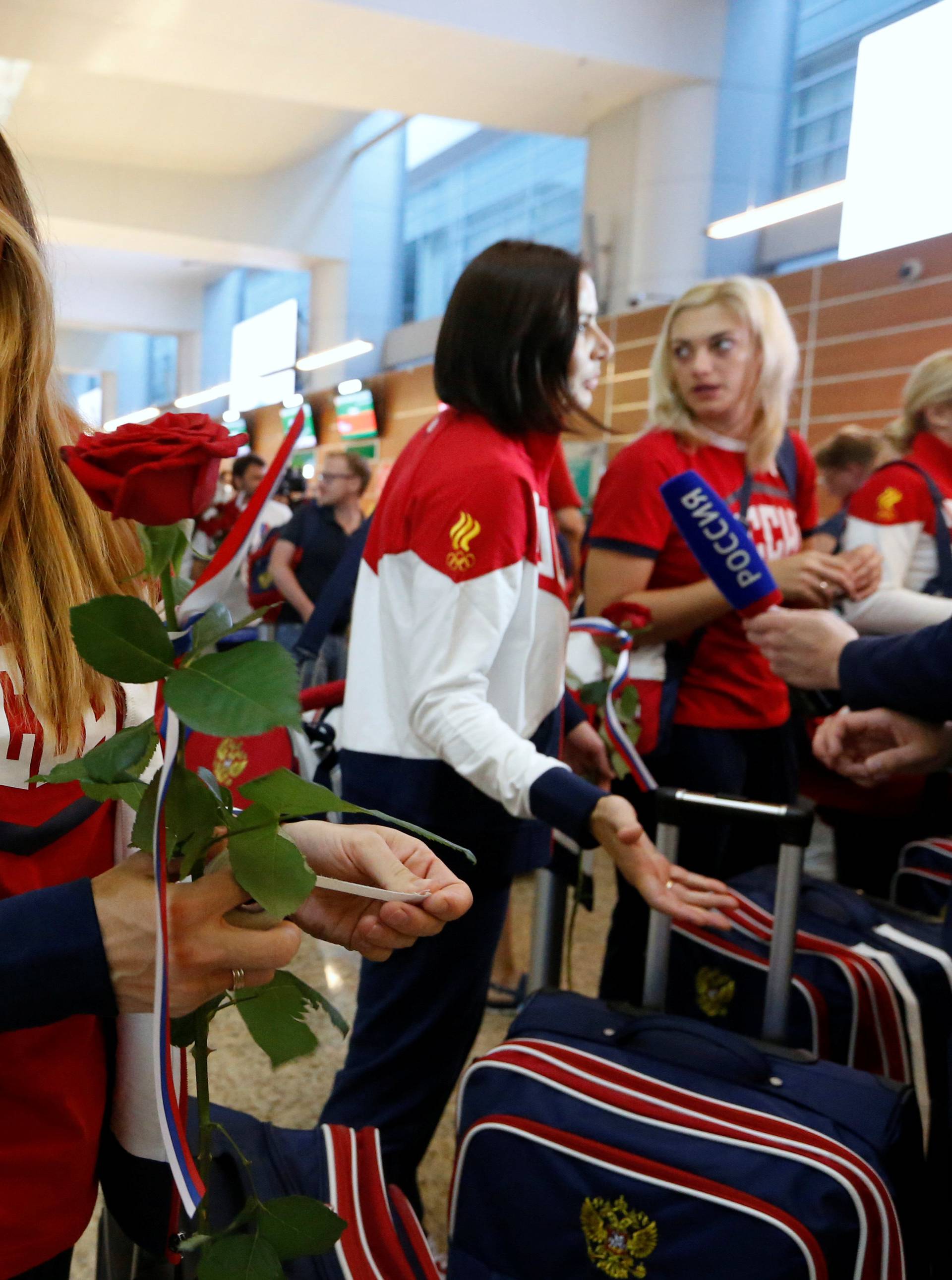 Russia's women's handball Olympic team member Sudakova waits for check-in before national team's departure to 2016 Rio Olympics at Sheremetyevo Airport outside Moscow