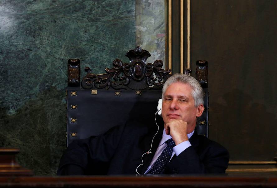 Cuba's First Vice-President Miguel Diaz-Canel listens to Vietnam's Communist Party Secretary General Nguyen Phu Trong at the University of Havana