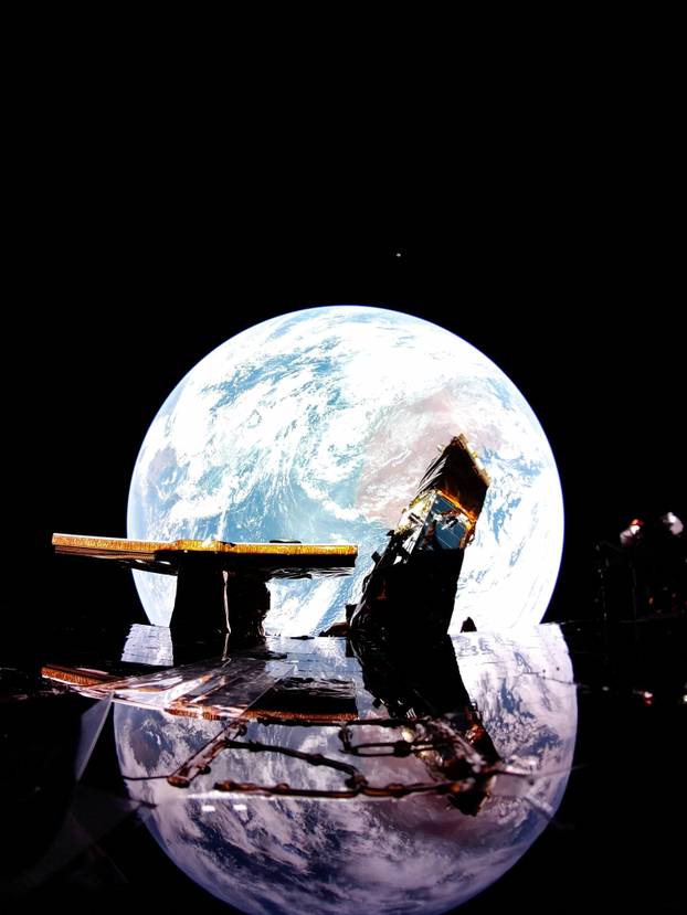 Planet Earth is reflected on Firefly Aerospace's Blue Ghost spacecraft's solar panel